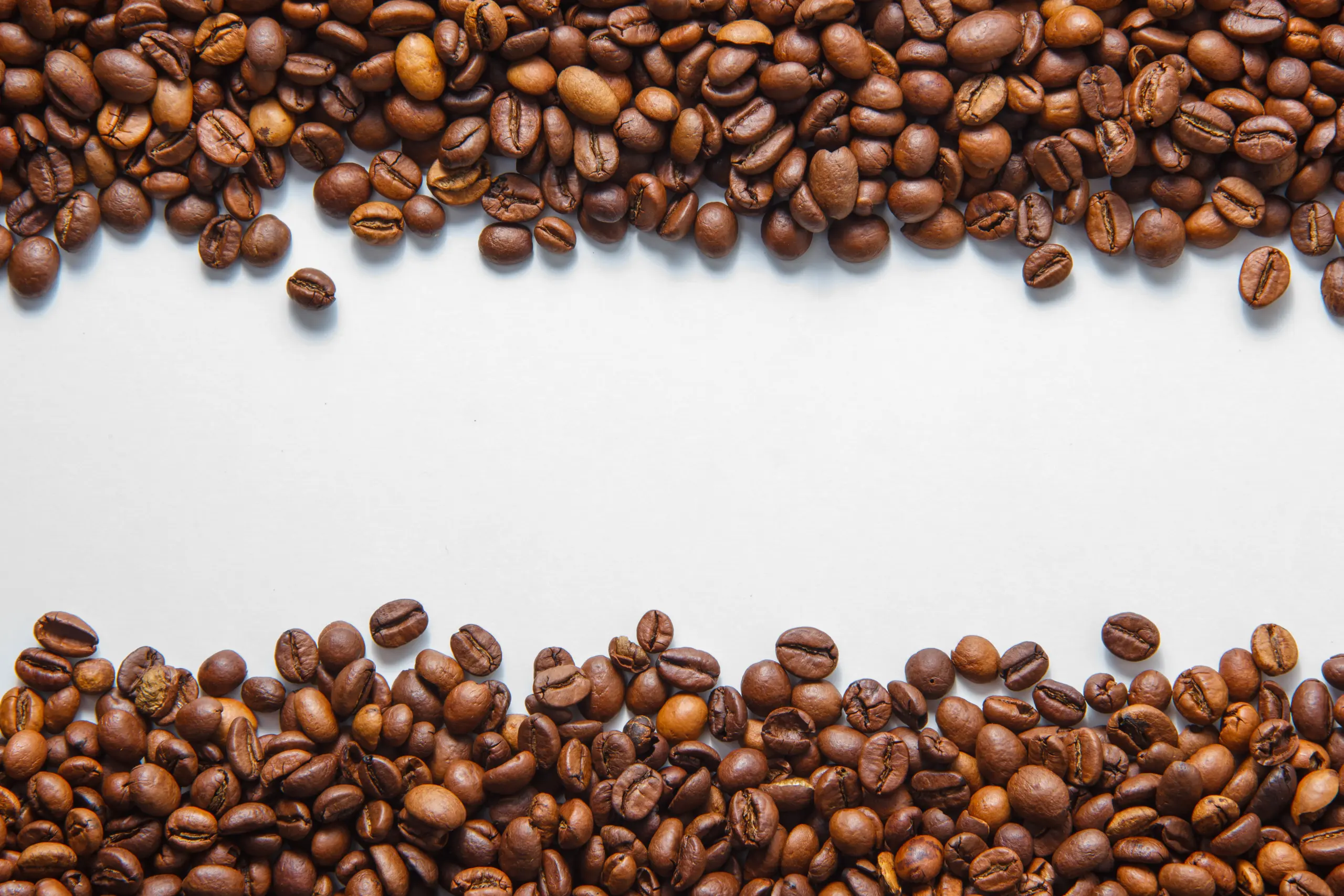 coffee-beans-top-view-white-background-space-text