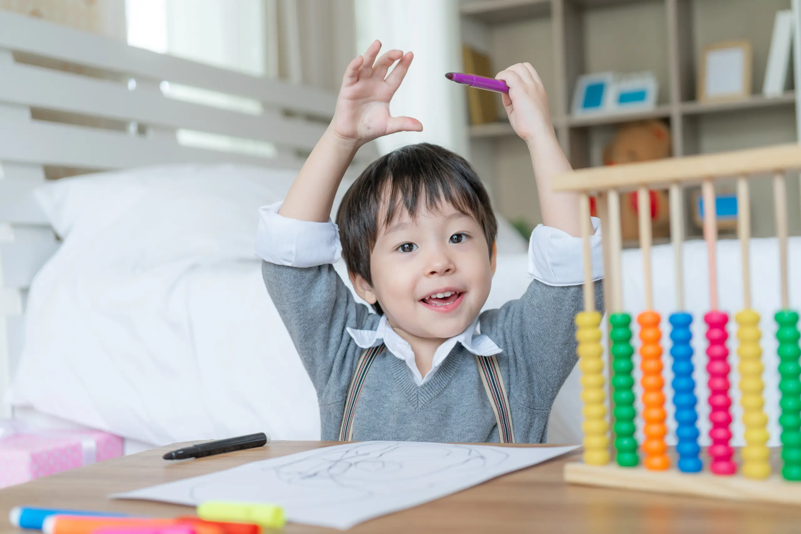 little-cute-boy-proud-when-he-finish-drawing-with-happiness-raised-two-hands-his-head-smile