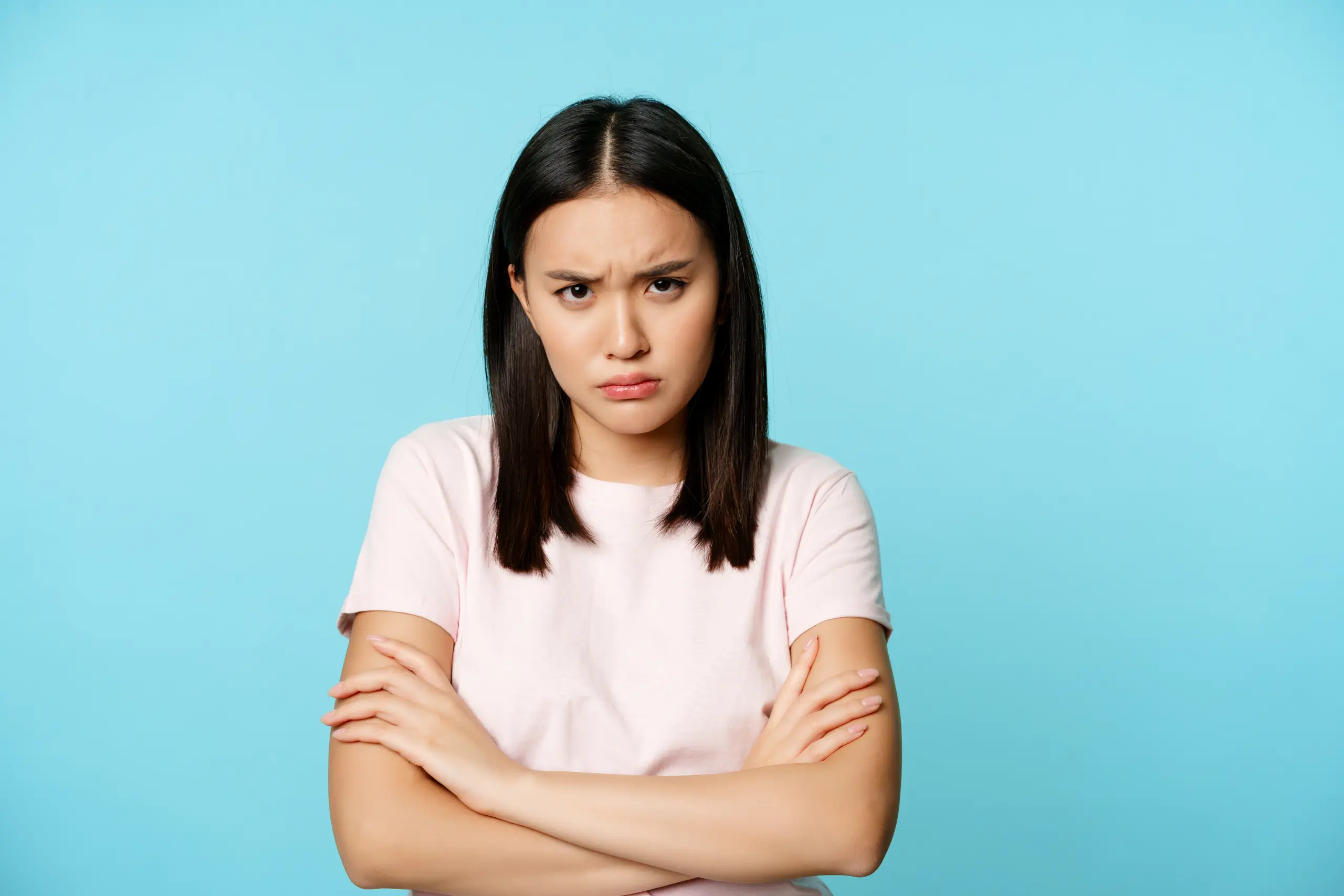 angry-teen-asian-girl-standing-offended-pose-frowning-sulking-feeling-defensive-standing-disa
