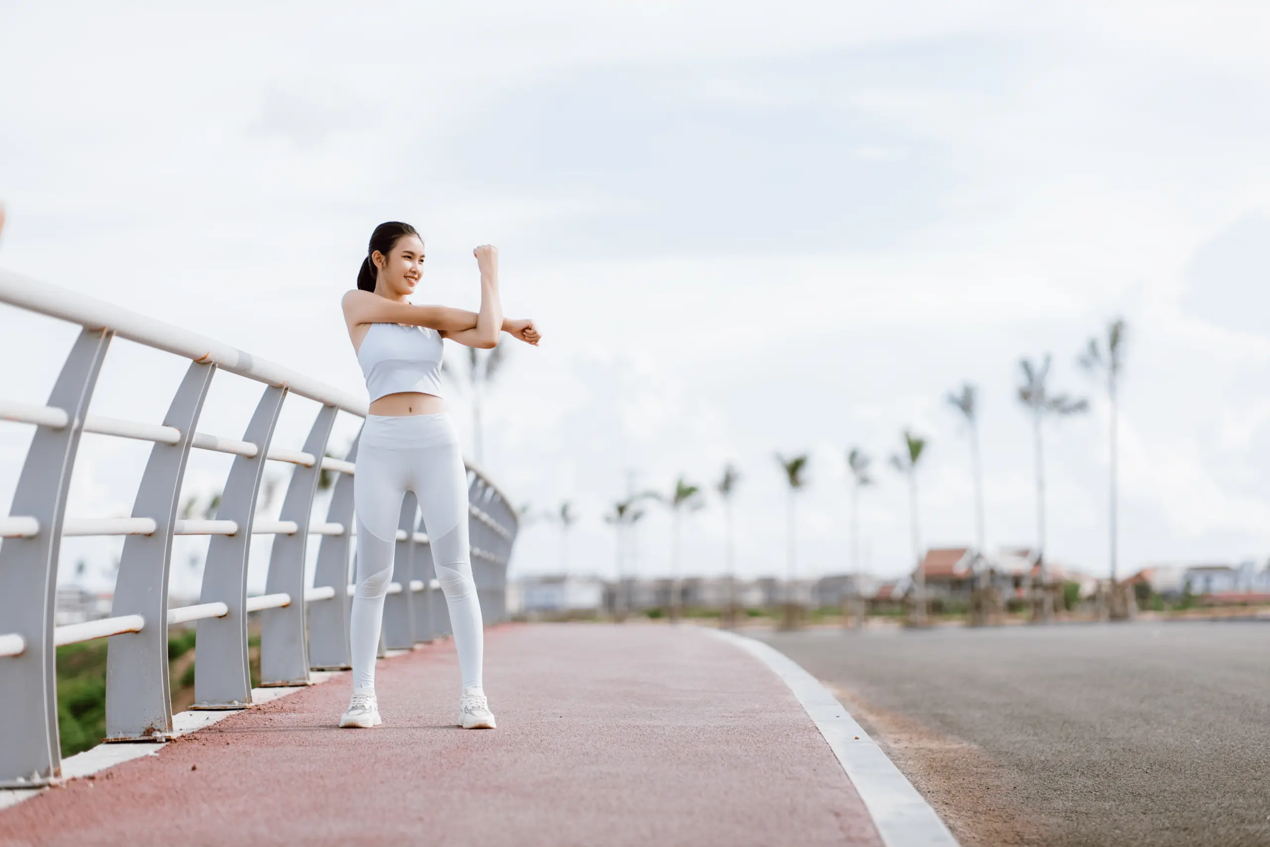 beautiful-asian-women-sportswear-warm-up-body-ready-exercise-outdoor-healthy-women-concept-running-workout