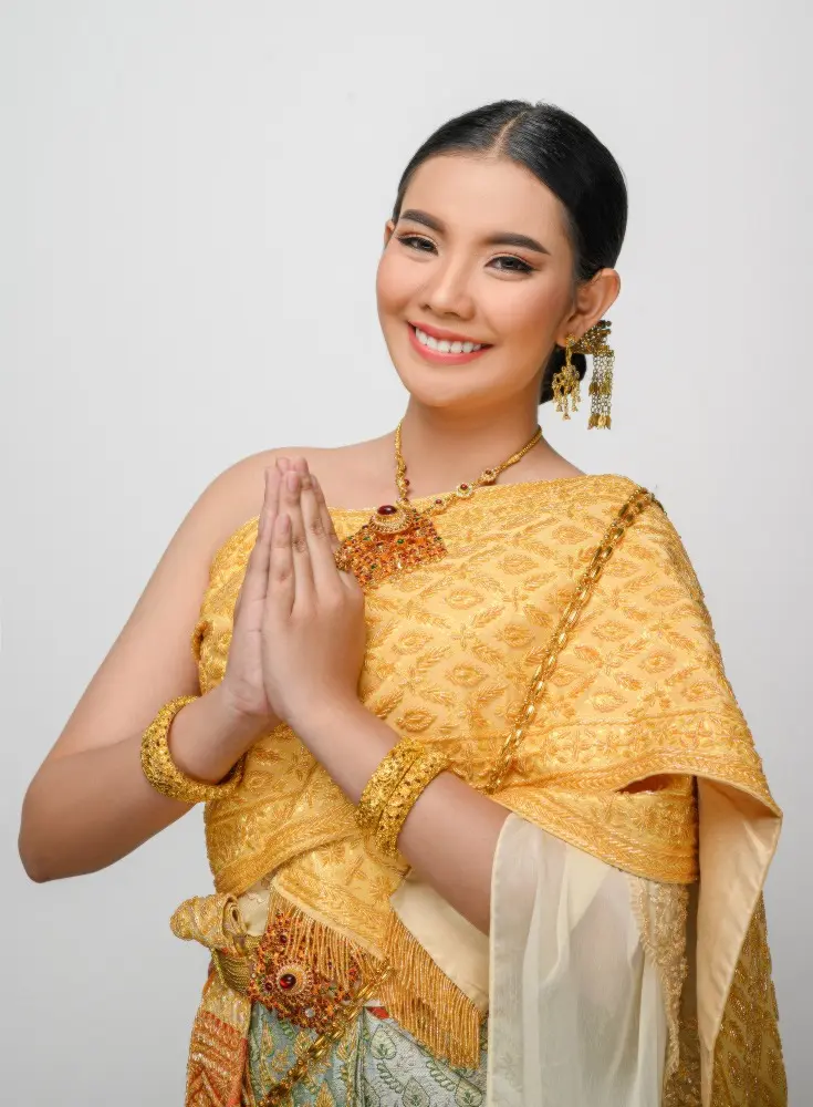 portrait-beautiful-asian-woman-traditional-thai-dress-costume-smile-pose-gracefully-white-wall 11zon