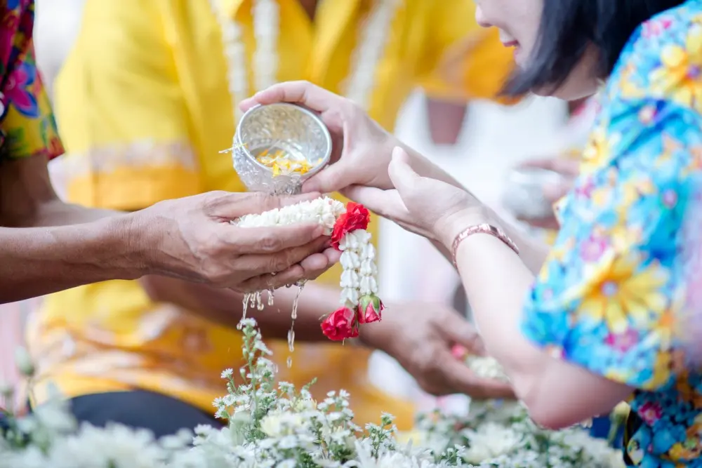 close-up-hand-holding-flower-song-kan-tradition-thailand 11zon
